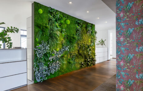 Large partition wall made of jungle moss for sound absorption in the office building